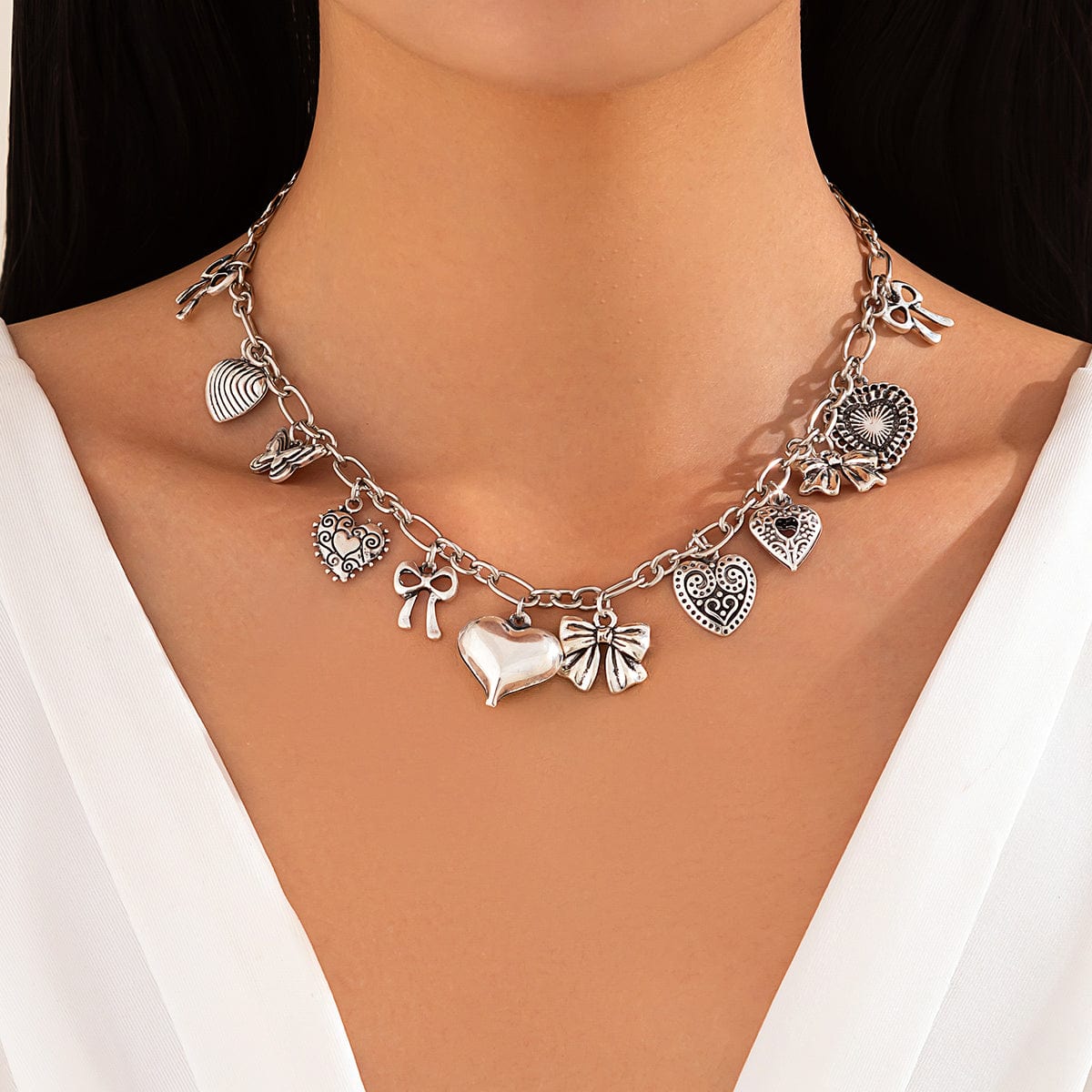 Elegant Gold Silver Tone Relief Heart Bowknot Tassel Necklace - ArtGalleryZen