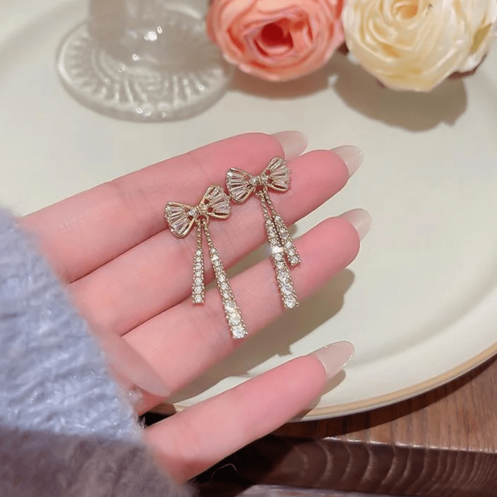 Trendy CZ Inlaid Bowknot Tassel Earrings - ArtGalleryZen